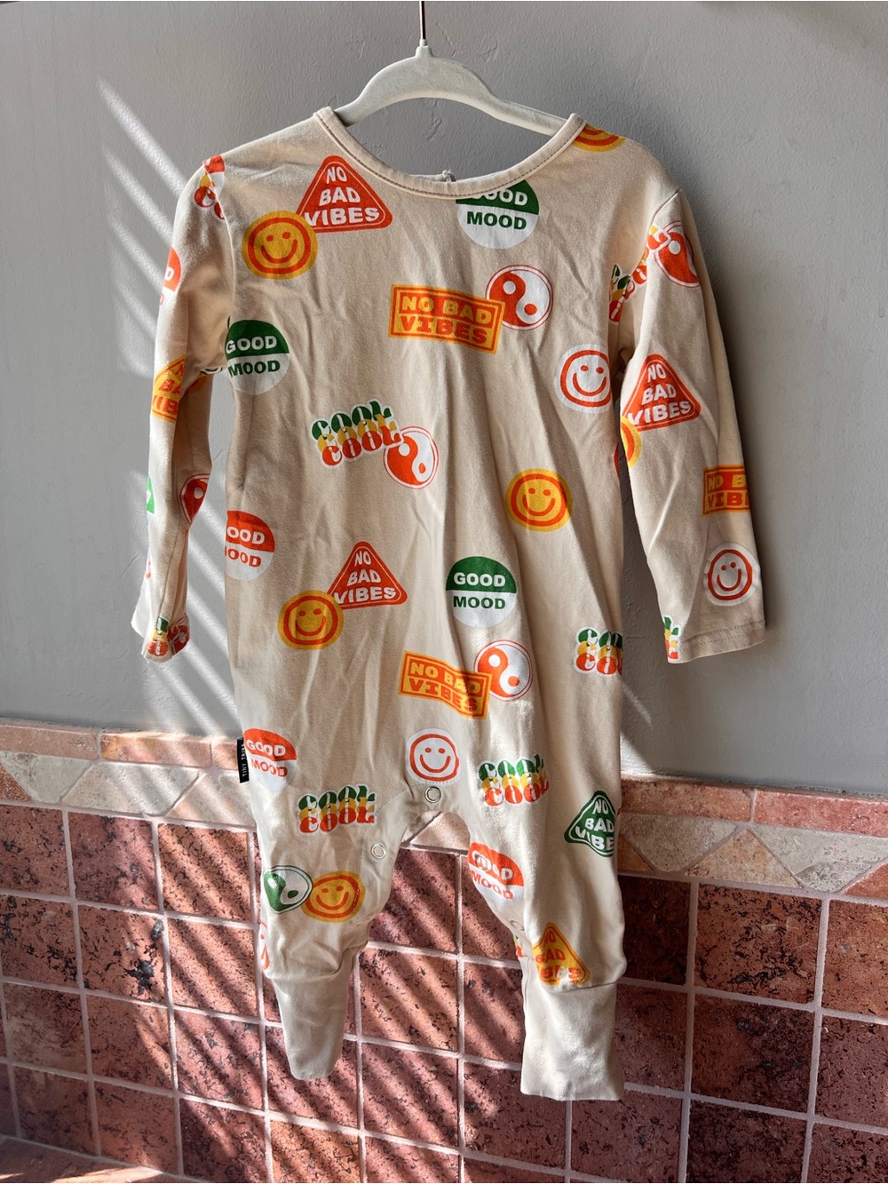 Tiny Tribe Cream One-Piece Romper with Multi-Color Happy Icons